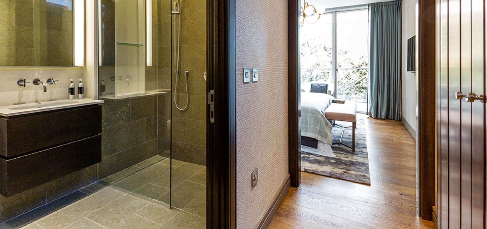 Guest Bathroom in the penthouse apartments with a view into the guest bedroom