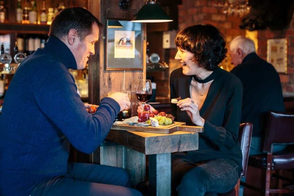 Couple enjoying cheese plate at Michellin Star Gastropub The Old Spot in Dublin 4, a short stroll from Lansdowne Place